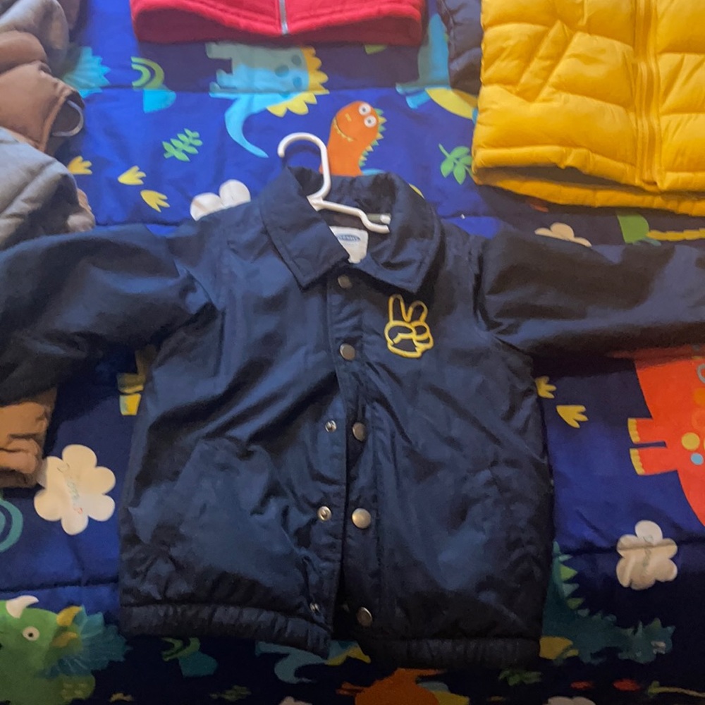 Navy blue wind breaker with peace sign